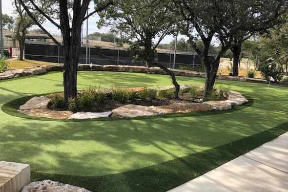 Charlotte residential backyard putting green grass